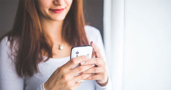 Girl using a smartphone.