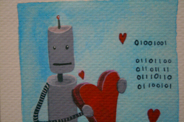 A robot in love holds a heart. 