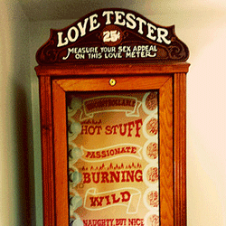 A photo of a "love tester" machine.