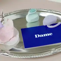 Eva and Fin, sex toys from Dame Products, on a platter.