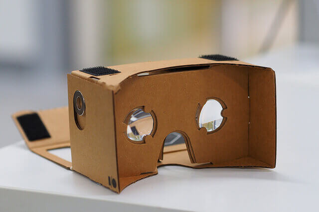 A empty Google Cardboard headset for watching VR videos rests on a counter.