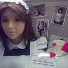 An Asian-looking love doll wearing a maid's outfit.
