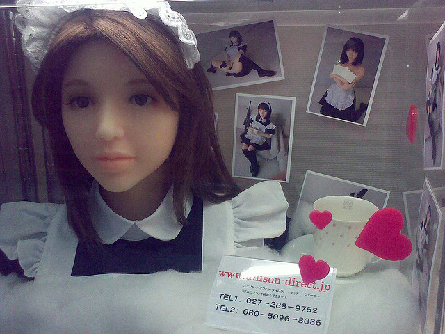 An Asian-looking love doll wearing a maid's outfit. 