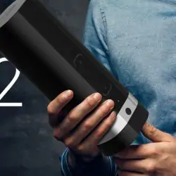 A man holds up the Kiiroo Onyx2 male sex sleeve.