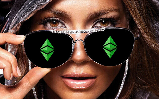 A woman wearing aviatar sunglasses with the Ethereum logo on each lens.