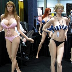Sex stands are posed standing up while wearing skimpy outfits.