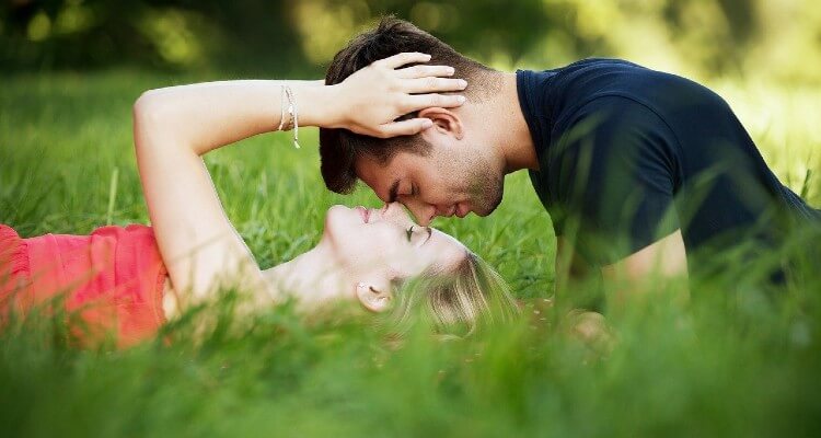 Love me do: Screenshot of lovely couple lying in grass