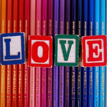 Screenshot showing colorful pencils with LOVE letters engraved on dice