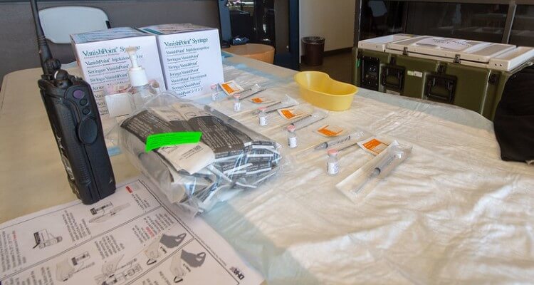 Naval Medical Center San Diego (NMCSD) First COVID-19 Vaccine kit displayed on table