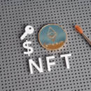 NFT letters and ethereum-style coin with paintbrush