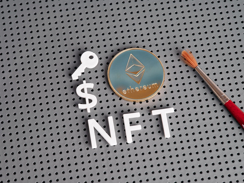 NFT letters with Ethereum-style coin and paintbrush