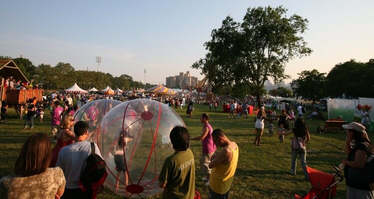 Image of Summer Party wherein people are enjoying outing with kids playing outdoor games