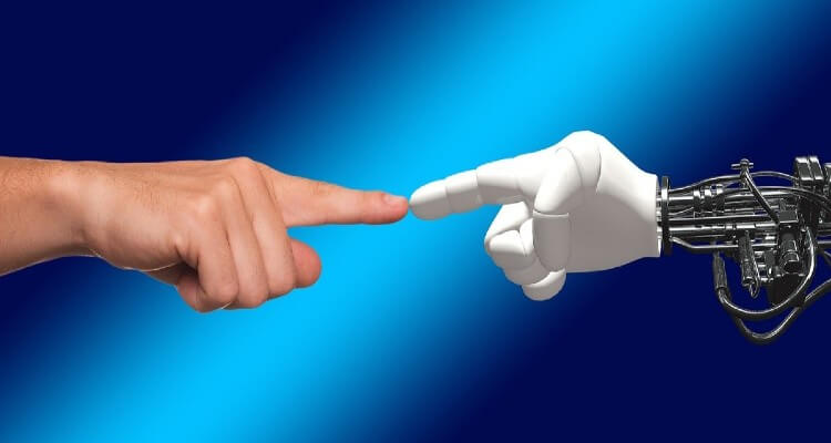 A screenshot of robotic arm finger and human finger connecting one other