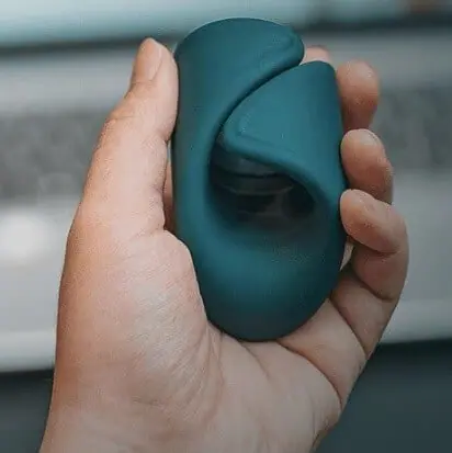 The Lovense Gush is a flexible and hands-free glans massager with a curved, wrap-like design that surrounds the penis and stimulates the tip.