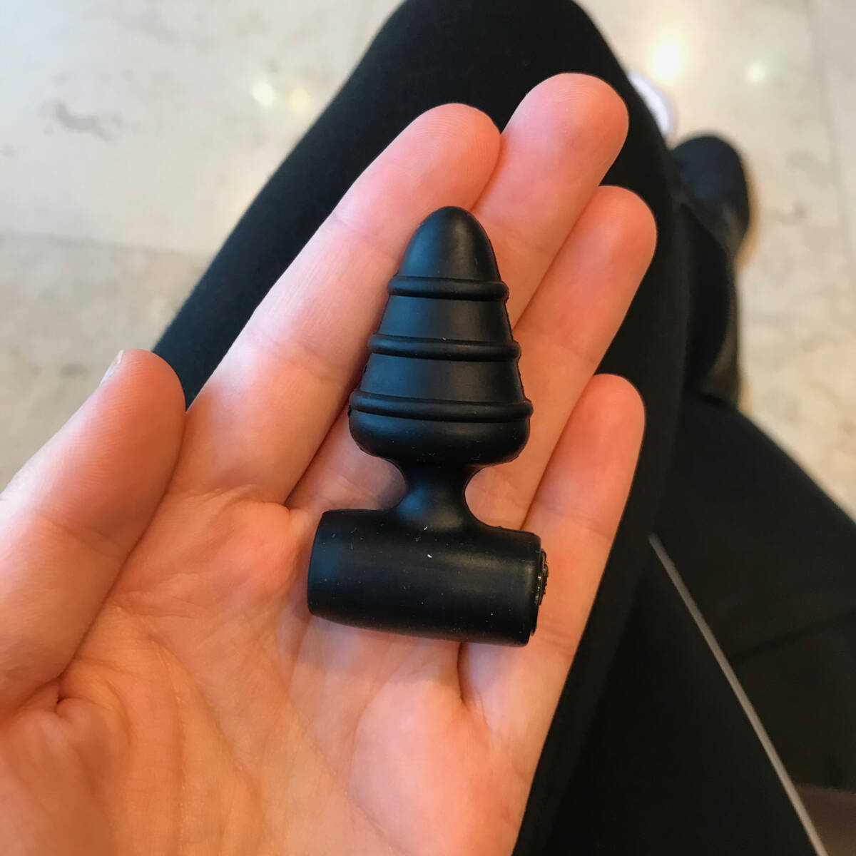 Image of palm holding sex toy buttplug