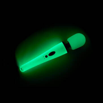 Ollie Glow in the Dark wand vibrator from Unbound, glowing green in the dark.